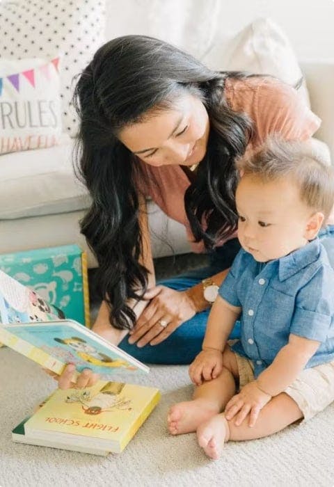 Baby and mom reading board book